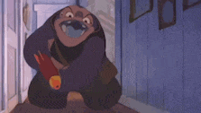 a cartoon character is sitting on the floor in a hallway holding a bottle of orange juice .