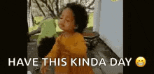 a little girl is dancing with the words `` have this kinda day '' written on the bottom .