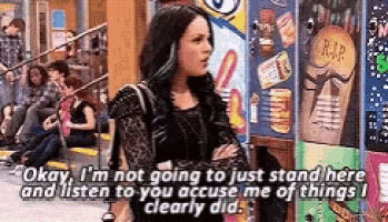 a woman is standing in front of a vending machine with a sticker on it that says rip .