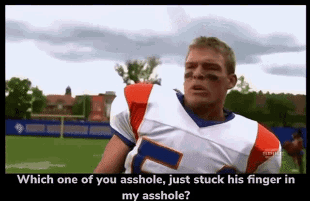 a football player with the number 7 on his jersey is talking to someone