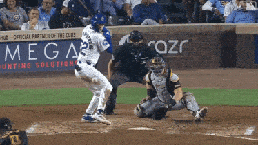 a baseball player with the number 2 on his jersey swings at a ball
