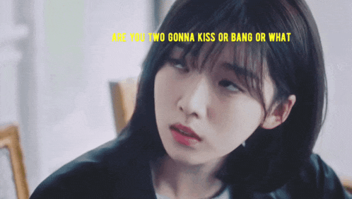 a close up of a girl with the words are you two gonna kiss or bang or what on the bottom
