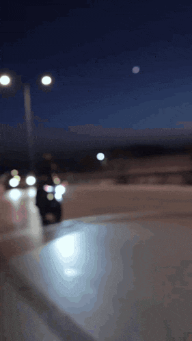 a blurry picture of a street at night