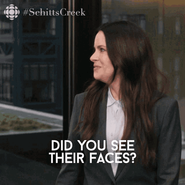 a woman says did you see their faces in front of a building