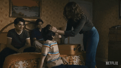a netflix ad shows a woman holding a boy in a bedroom