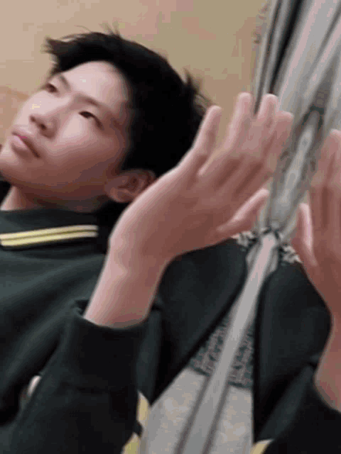 a person 's hands are visible in a mirror