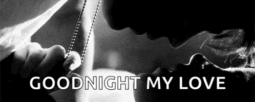 a black and white photo of a man and woman kissing with the words `` goodnight my love '' above them .