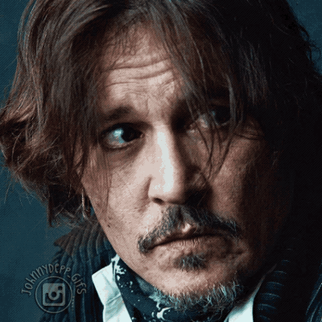 a close up of a man 's face with a tommydepe gifs logo