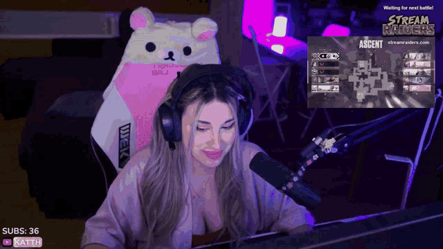 a woman wearing headphones is playing a game called ascent