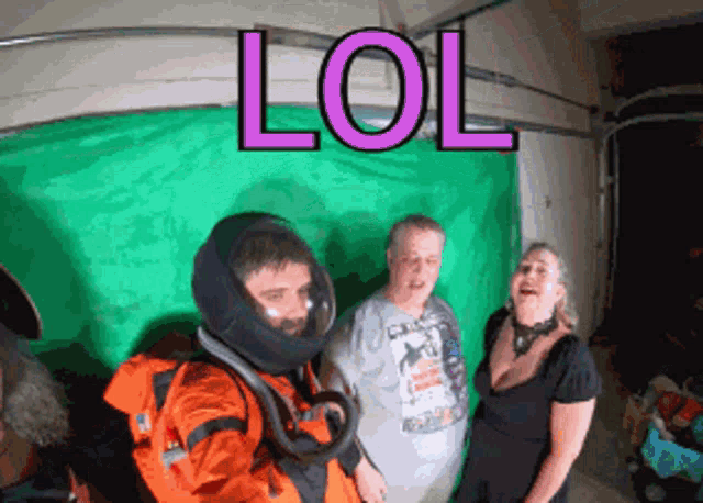 a man in a space suit stands in front of a green screen with the word lol written on it