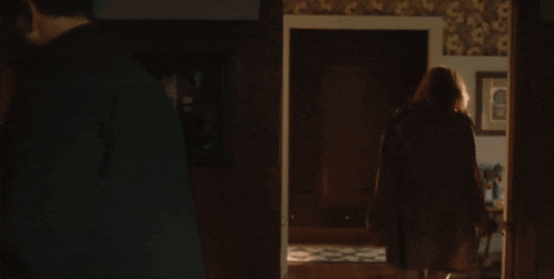 a woman standing in a doorway with the words " i always remember your dick " on the bottom