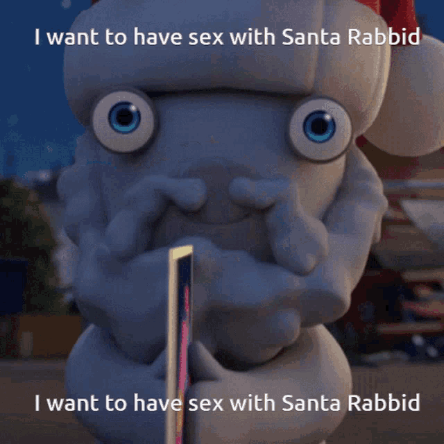 a stuffed animal with a santa hat on is holding a picture of santa rabbid