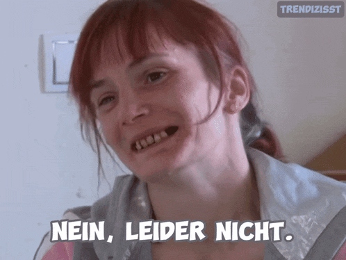 a woman with red hair says nein leider nicht in a foreign language