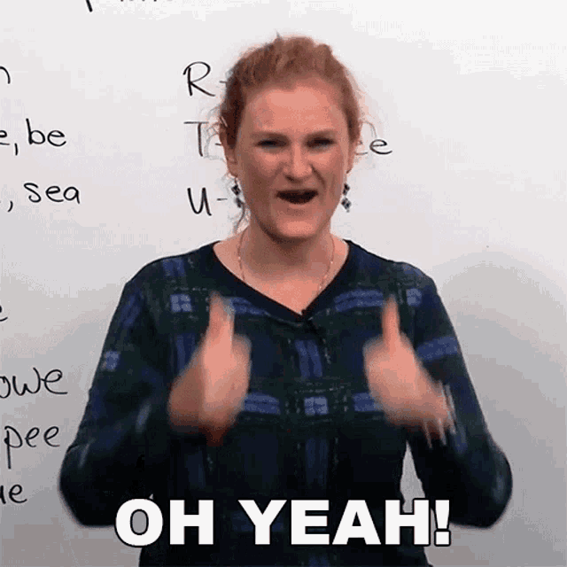 a woman giving a thumbs up with the words oh yeah behind her