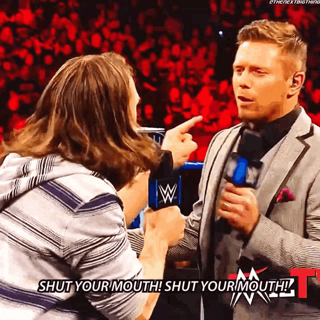 a man talking into a microphone with the words shut your mouth written on the bottom