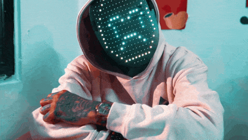 a man wearing a hoodie with a mask on his face that says 00