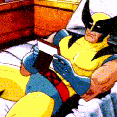 wolverine is reading a book while laying on a bed
