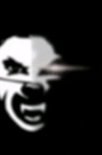 a blurred image of a joker 's face with a long nose .