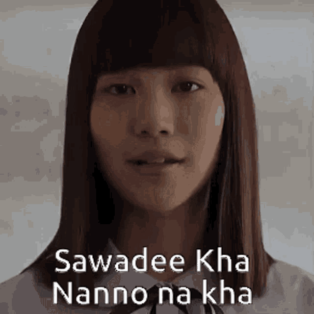 a close up of a woman 's face with the words sawadee kha nanno na kha written on her face .