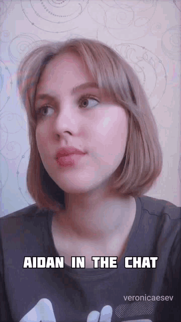 a girl with the words aidan in the chat on her face