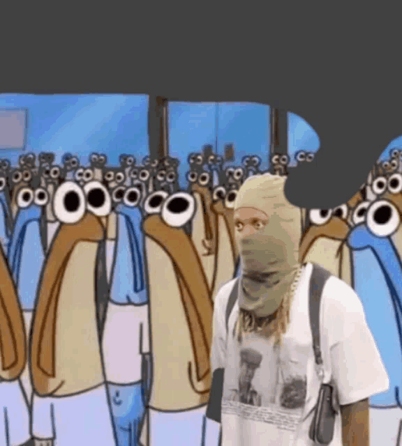 a man wearing a ski mask stands in front of a crowd of penguins