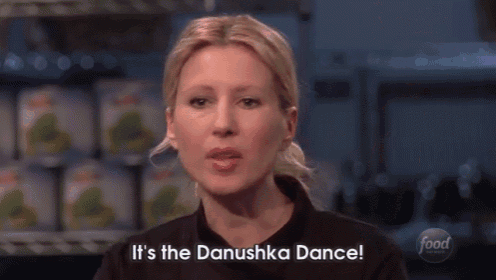 a group of people standing on a stage with the words it 's the danushka dance on the bottom