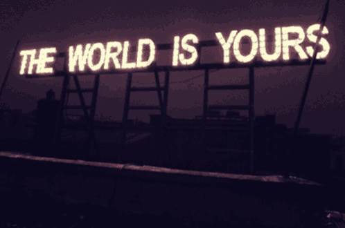 a sign that says the world is yours is lit up