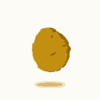 a chicken nugget is falling in the air on a white background