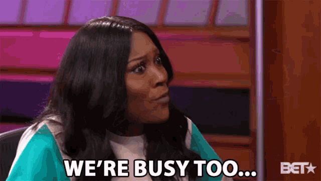 a woman says we 're busy too with a bet logo in the background