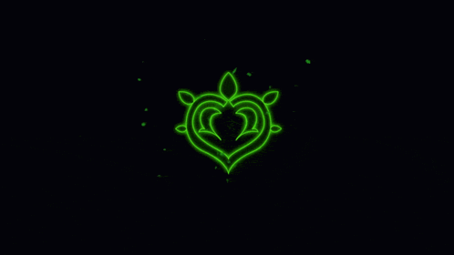 a green glowing heart with leaves on a black background .