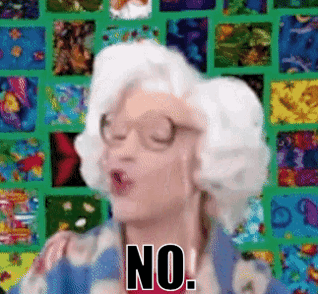 a woman with white hair says no in front of a colorful background