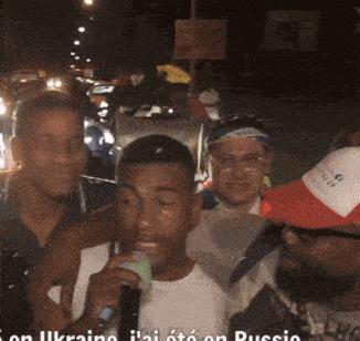 a group of men are posing for a picture with the words on ukraine i 'ai oto on russia below them