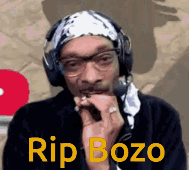 snoop dogg wearing headphones and a bandana says rip bozo on the bottom