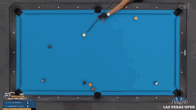 a man is playing pool in front of a diamond pool table