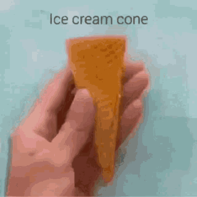 a person is holding a cup with a hole in it and the word cement on it .