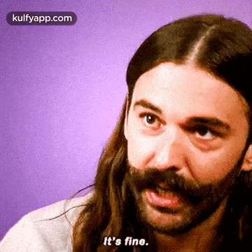 a man with long hair and a beard is saying it 's fine