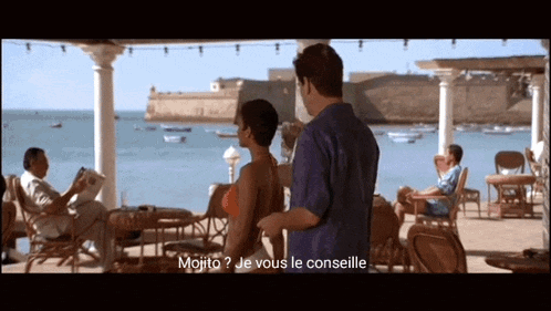 a man standing next to a woman with the words mojito je vous le conselle written on the screen