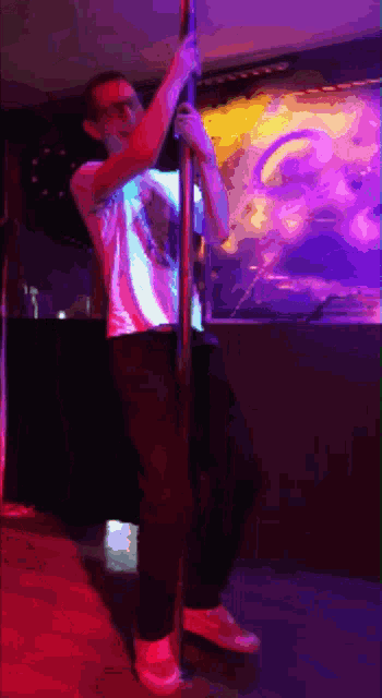 a man standing on a pole with a purple background