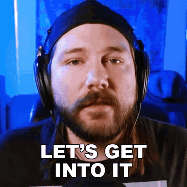 a man with a beard wearing headphones and a hat says let 's get into it