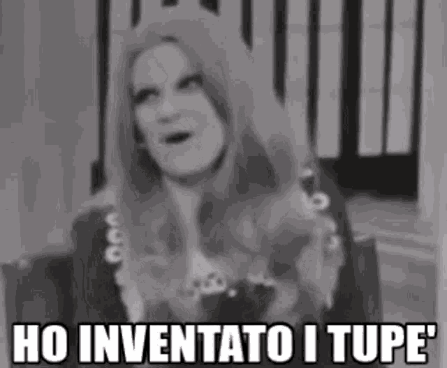 a black and white photo of a woman with long hair and the words ho inventato i tupe