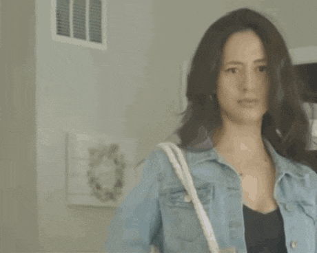 a woman in a denim jacket is talking to another woman and says `` what 's wrong with you ? ''