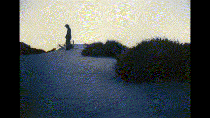 a person standing on top of a snowy hill