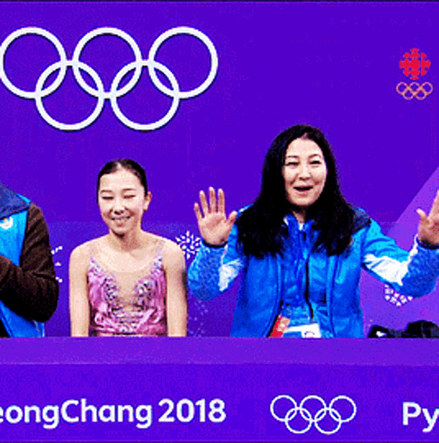 a group of people are sitting in front of a sign that says yeongchang 2018