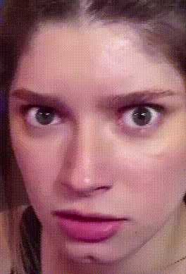 a close up of a woman 's face with dots on it