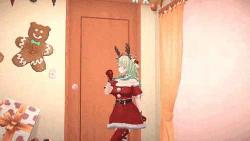 a girl in a santa costume is standing in a room with a gingerbread man on the wall