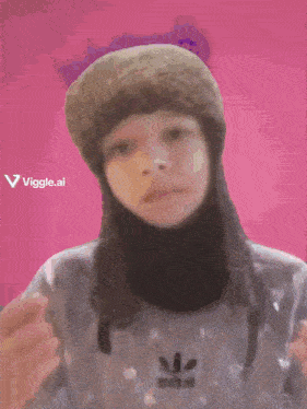 a person wearing a hat and a sweater with the word viggle.ai on the bottom