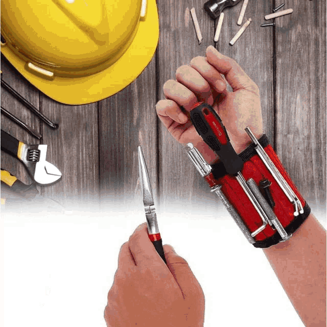 a person wearing a wristband holding a screwdriver
