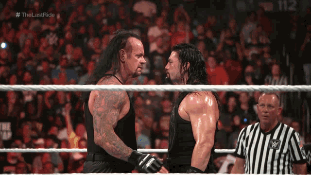 Undertaker Roman Reign GIF - Undertaker Roman Reign Wwe GIFs