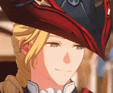 a close up of a person 's face wearing a red hat