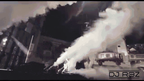 smoke coming out of a building with the dj r3z logo in the corner
